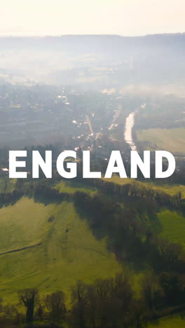 Vertical-Video-Aerial-Drone-Shot-Of-Fields-And-Countryside-In-UK-With-Graphic-Spelling-Out-England